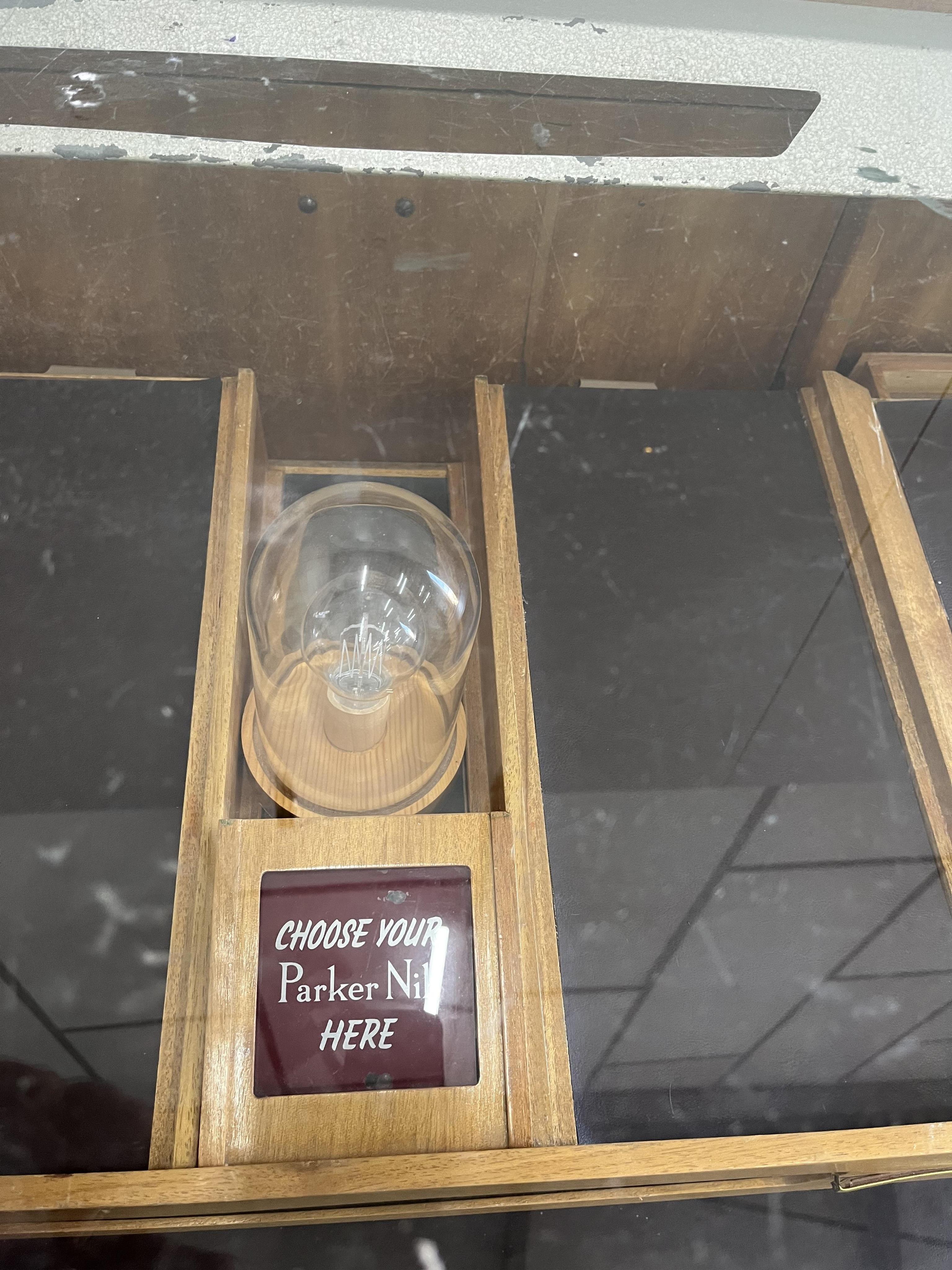 A mid century teak Parker Pen shop display cabinet, width 182cm, depth 62cm, height 99cm. Condition fair to good.